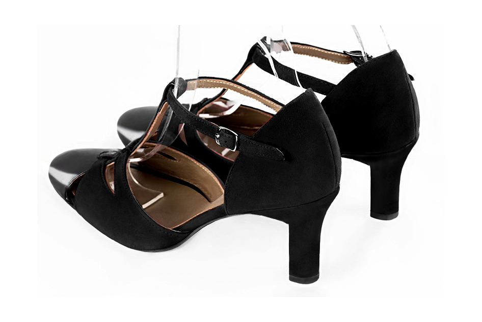 French elegance and refinement for these gloss black dress T-strap open side shoes, 
                available in many subtle leather and colour combinations. A pretty model with a comfortable "Salomé" strap and good support.
Its charming spyglass cut-out gives you plenty of scope for personalisation.  
                Matching clutches for parties, ceremonies and weddings.   
                You can customize these shoes to perfectly match your tastes or needs, and have a unique model.  
                Choice of leathers, colours, knots and heels. 
                Wide range of materials and shades carefully chosen.  
                Rich collection of flat, low, mid and high heels.  
                Small and large shoe sizes - Florence KOOIJMAN